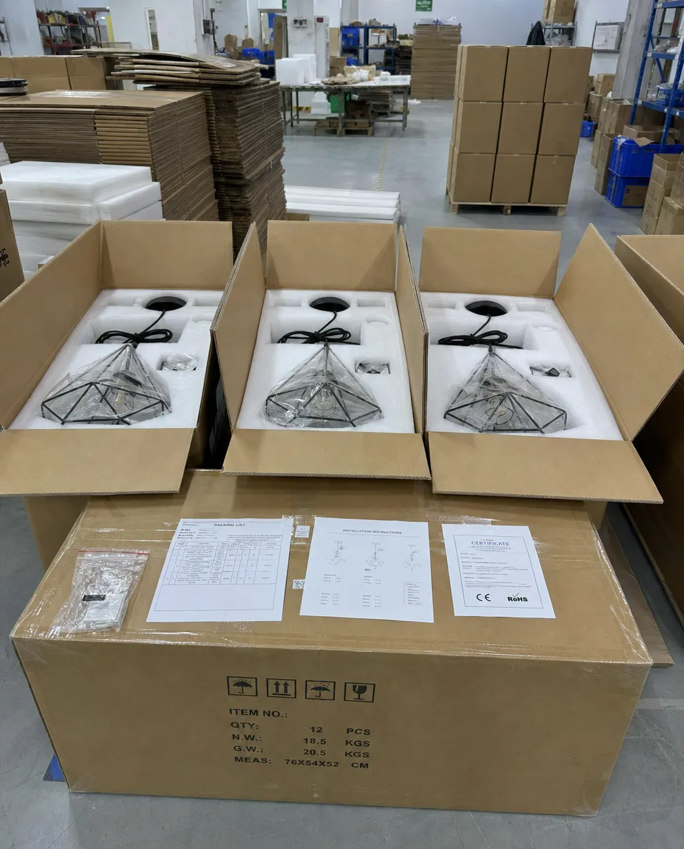 Industrial pendant lighting export packaging showing foam-lined individual cartons and master carton configuration for ocean freight