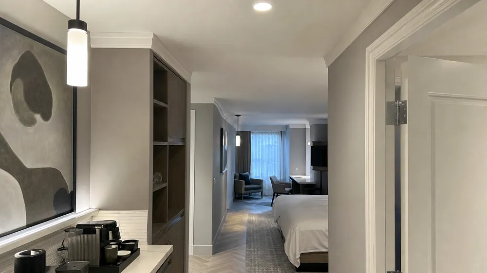 LED pendant lighting installed across hotel corridor and guest room zones