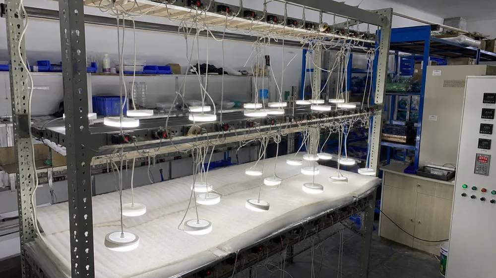 LED pendant lighting thermal aging test station showing fixtures under sustained load testing