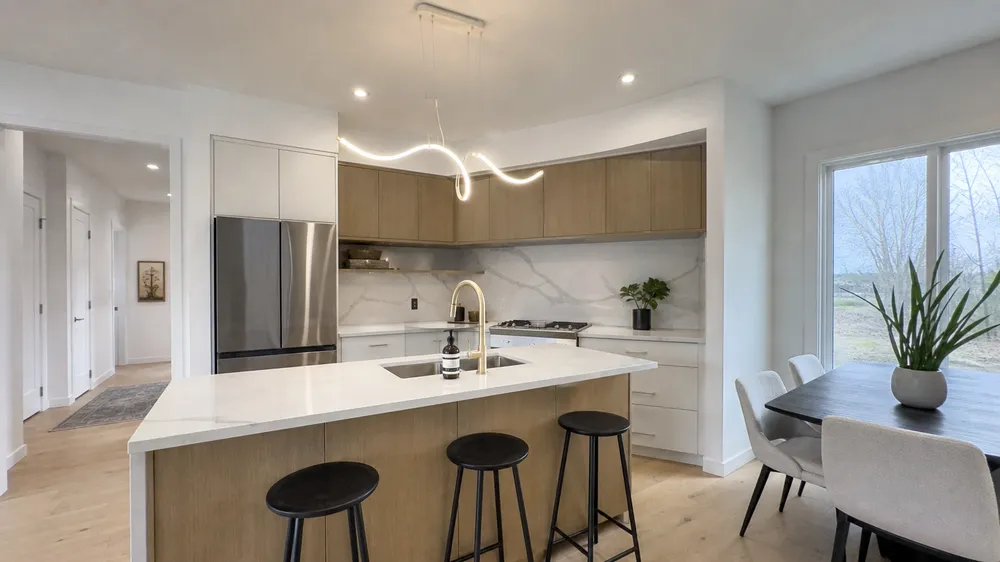 LED pendant lighting over kitchen island in residential development