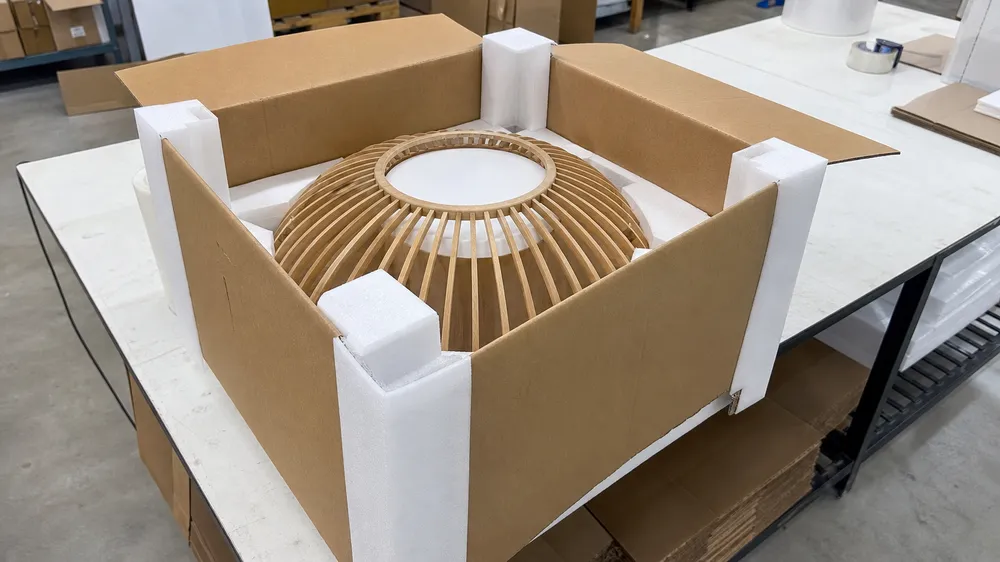Wood pendant lighting packaged for e-commerce last-mile delivery with corner impact protection