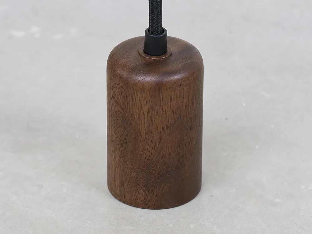 Walnut wood grain showing darker natural color and fine grain for premium pendant lighting