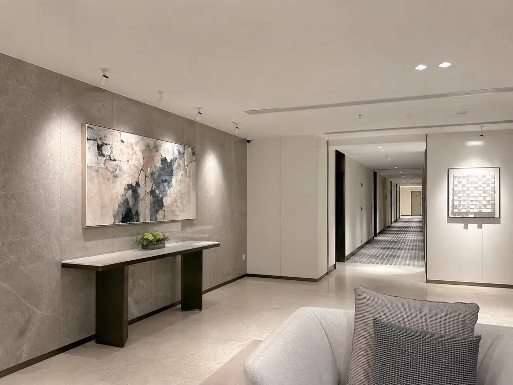 Adjustable spotlights providing accent lighting in hotel lobby and corridor feature wall applications
