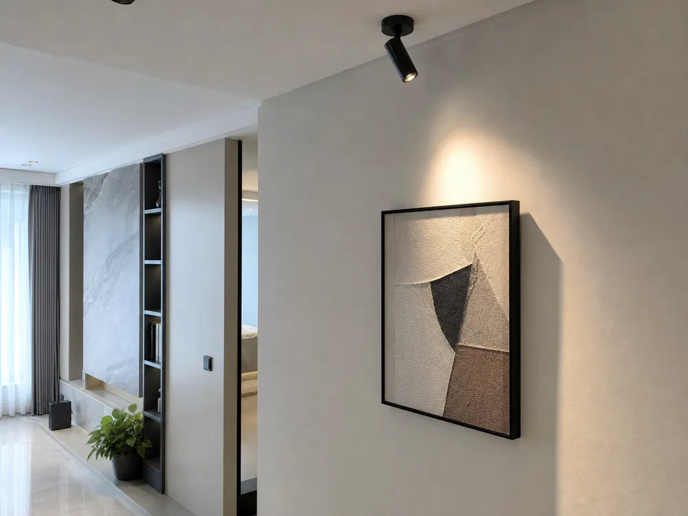 Adjustable spotlight in luxury residential setting providing artwork accent and architectural feature illumination