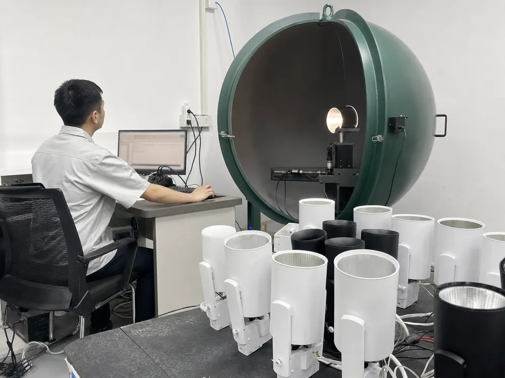 In-house optical lab running photometric beam angle testing on adjustable spotlight production samples
