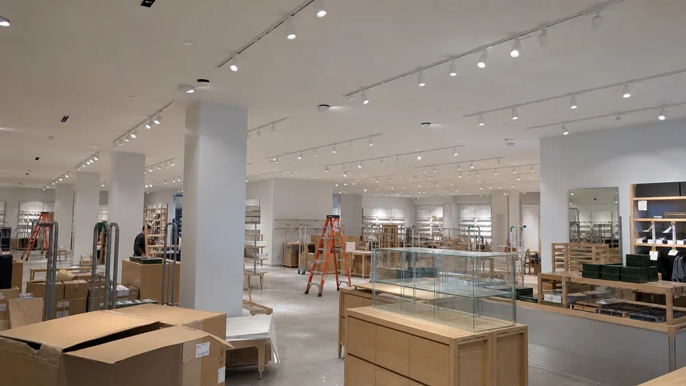Ceiling spotlights used for retail merchandise accent lighting in chain store