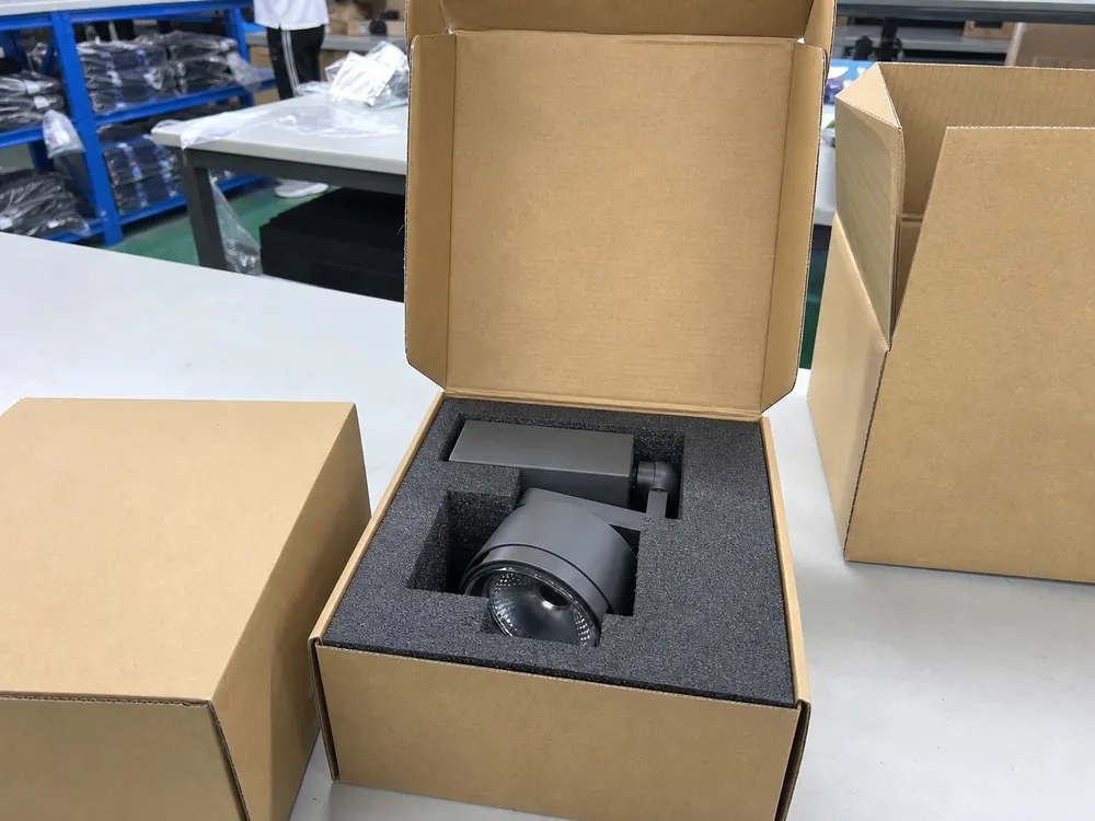Die-cut foam insert packaging for spotlight fixtures showing individual head mechanism protection