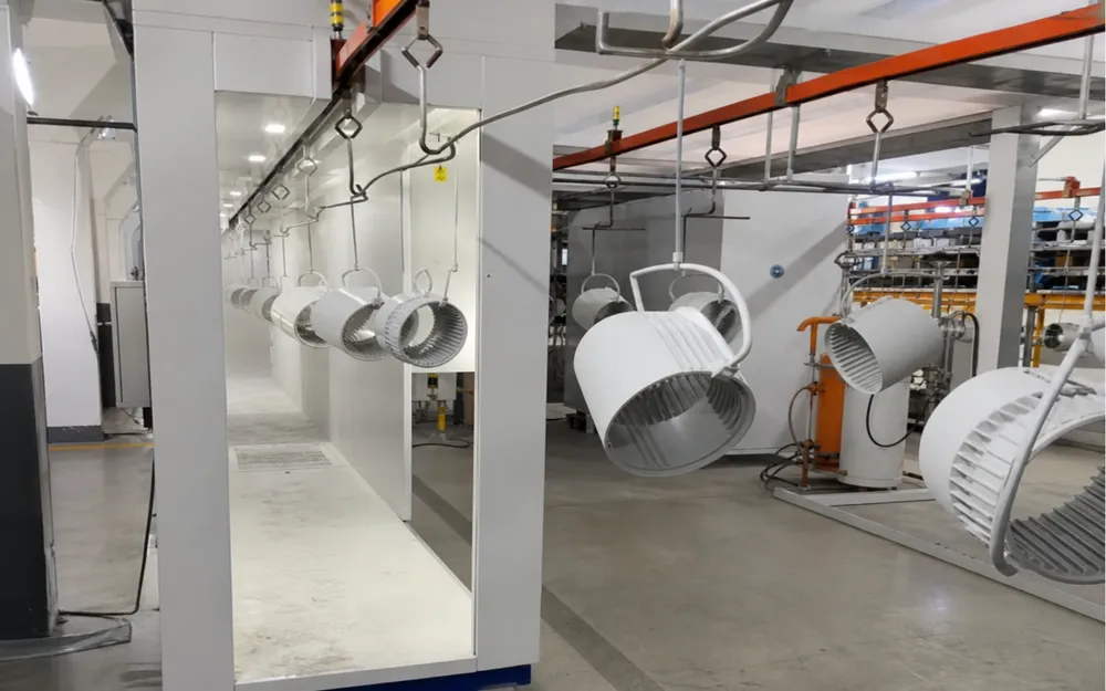 In-house powder coat line with automated application for consistent surface finishing