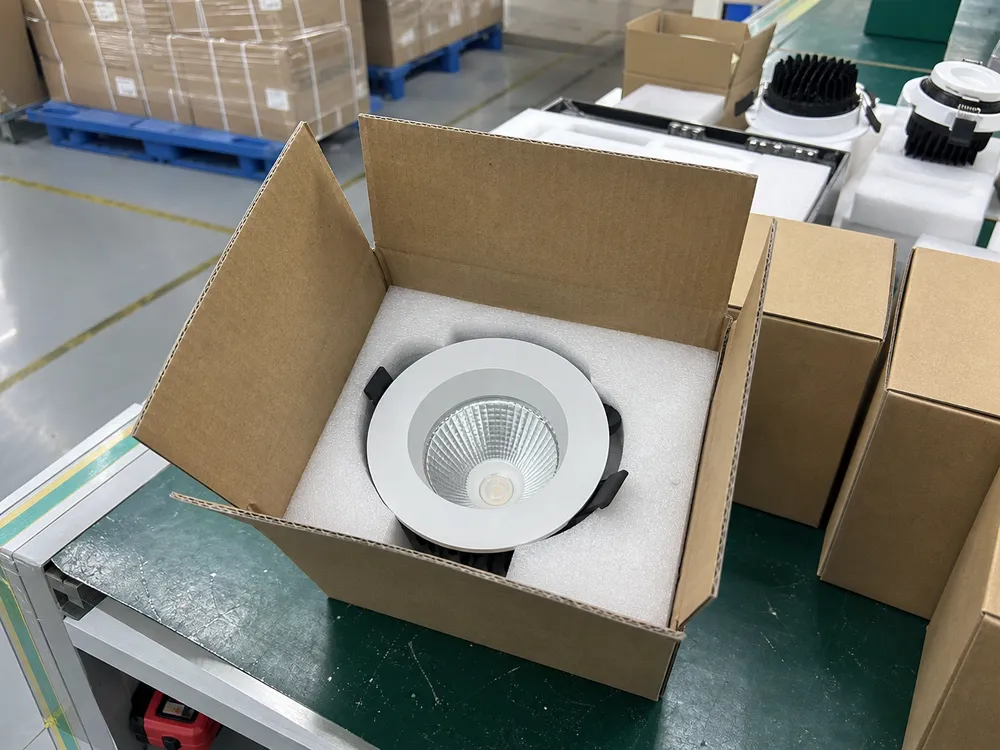 Individual foam-lined inner carton packaging for recessed spotlights showing trim ring protection