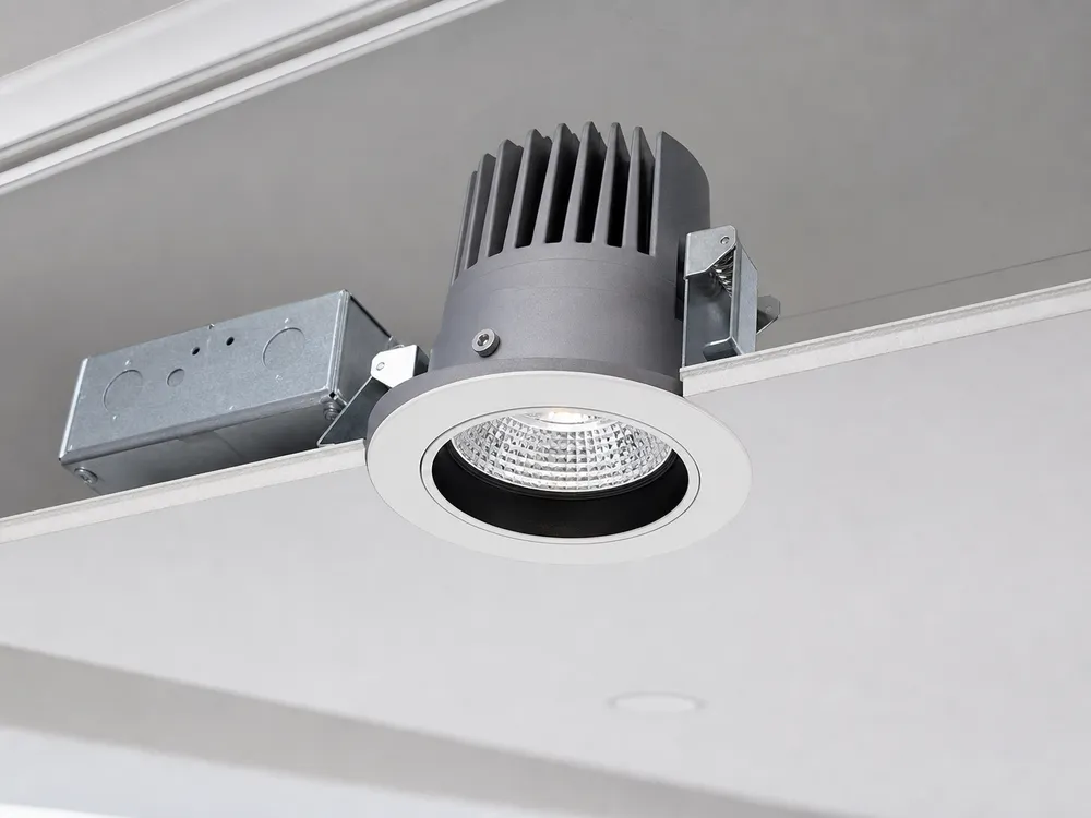 Commercial-grade recessed spotlight with die-cast aluminum housing and flush trim ring installation