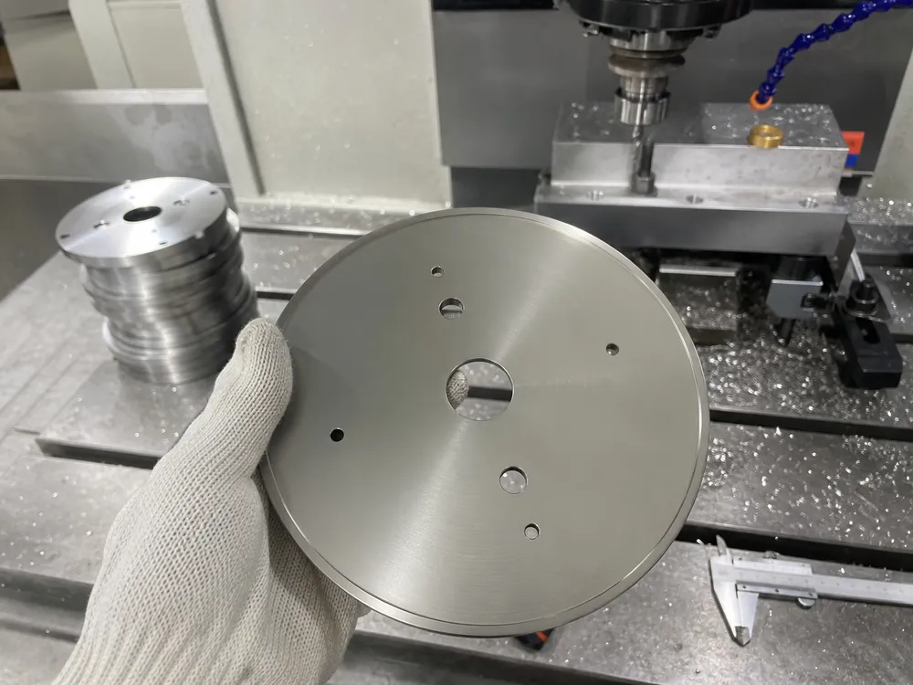 CNC machined wall sconce backplate with ±0.1mm flatness tolerance for flush wall mounting