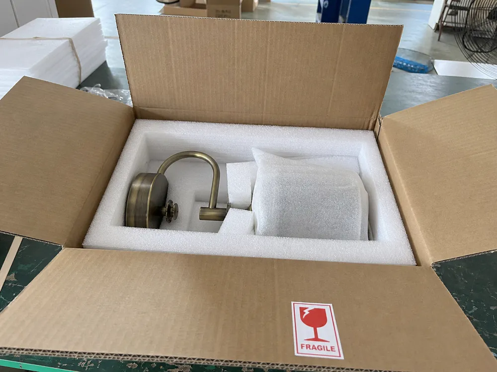 Wall sconce packaging with EPE foam inserts and corrugated outer carton for ocean freight protection
