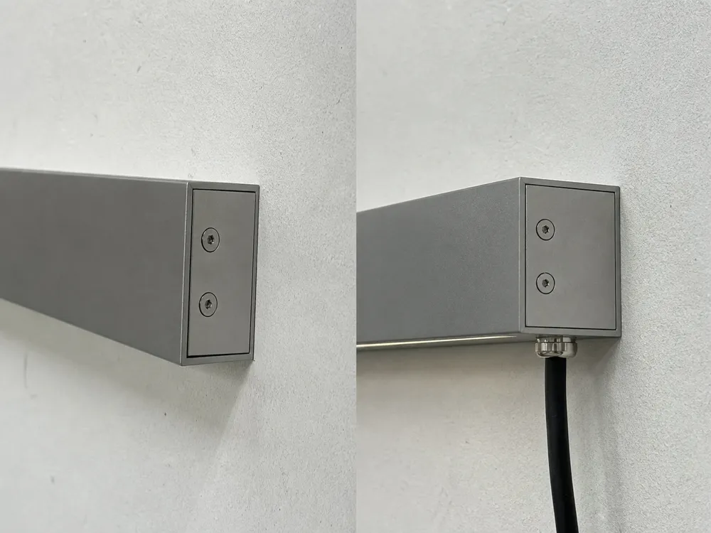 CNC-machined mounting face of linear wall light showing flush wall installation with ±0.1mm flatness
