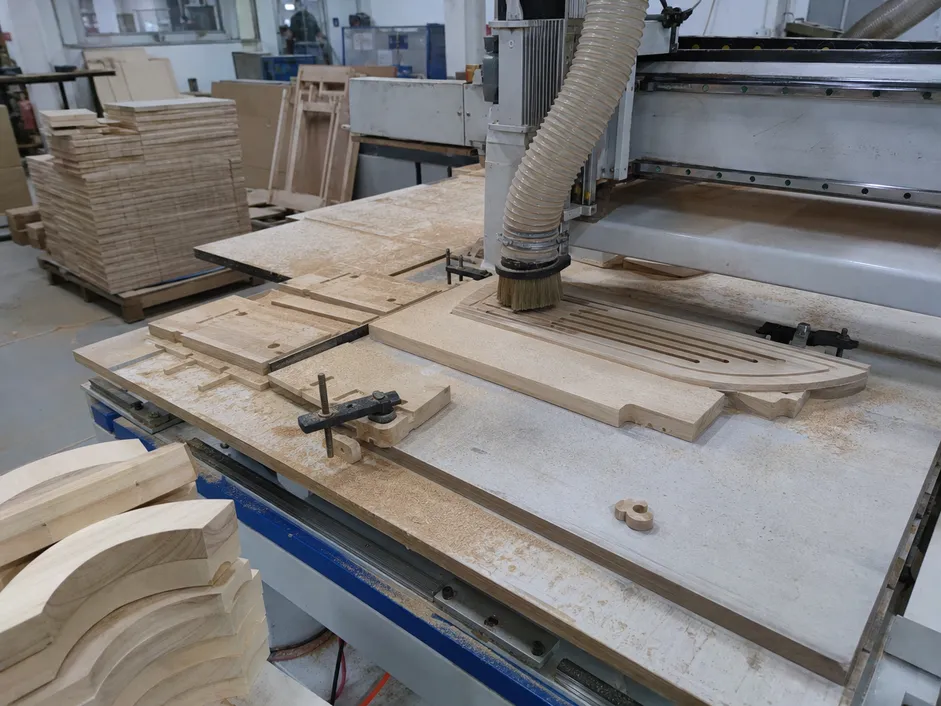 CNC routing of wood components for wall lighting fixtures in ASCLighting factory
