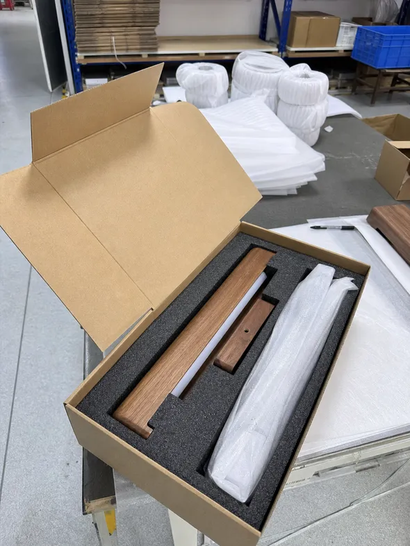 Wooden wall lighting packaged with custom foam inserts for e-commerce transit protection