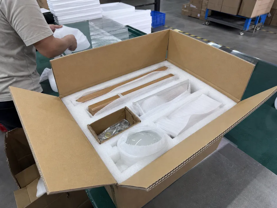 Multi-layer packaging system for wooden wall lighting fixtures showing EPE foam inserts and double-walled cartons